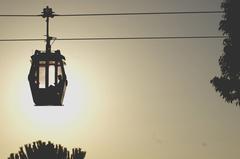 Silhouette of a cable car against colorful sky at sunset in Barcelona, Spain