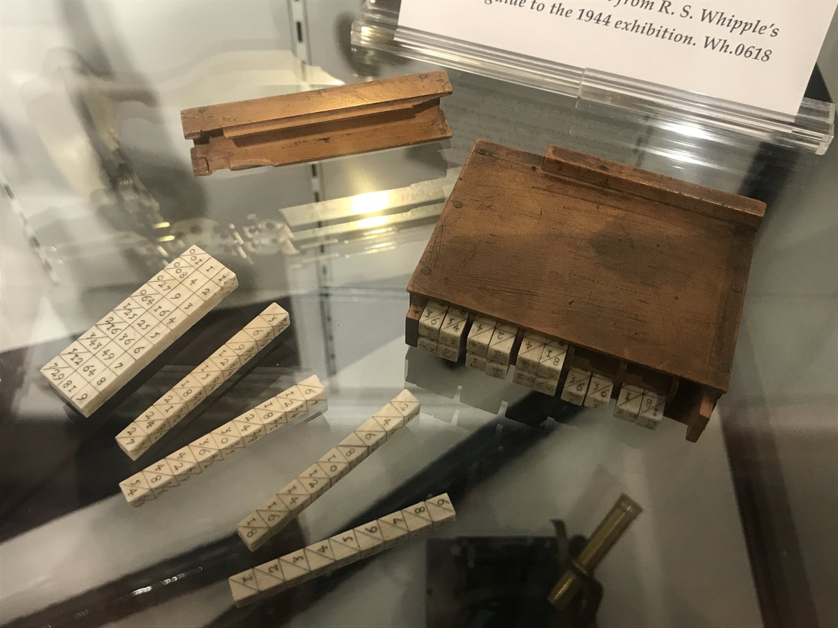 Vintage wooden Napier's Bones calculator with engraved numbers