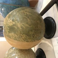Lunar globe displaying the Moon's surface features and markings