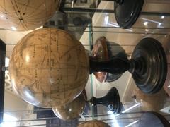 Flammarion's Mars globe illustration showing detailed surface features of Mars with artistic depiction