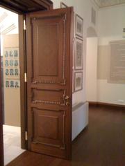 Entrance door of Galatasaray Museum with ornate metalwork and signage