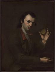 Portrait of Alexandre Perregaux seated with head turned towards the viewer, holding a golden medallion, wearing a green jacket with red collar