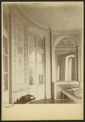 Ornate wooden paneling in the oval salon of Hôtel de Lisleferme