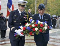 U.S. Air Force Capt. Gregory Hermack and French Air Force Lt. Col. Guillaume Guyot laying wreath during Veterans Day ceremony at Lafayette Escadrille Memorial Cemetery