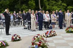 Distinguished guests honoring fallen heroes during Memorial Day ceremony at Lafayette Escadrille Memorial Cemetery in France 2024