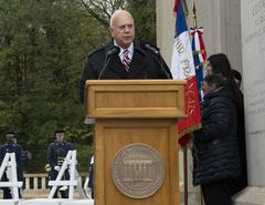 William M. Matz Jr. giving host remarks during Veterans Day ceremony at Lafayette Escadrille Memorial Cemetery