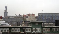 View of Hamburg cityscape from the river with buildings and trees along the waterfront