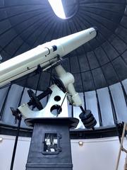 Interior view of the Equatorial Room at Cincinnati Observatory featuring a large equatorial telescope