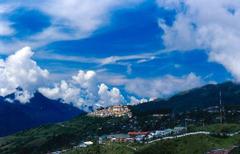 Tawang Monastery surrounded by snow-capped mountains