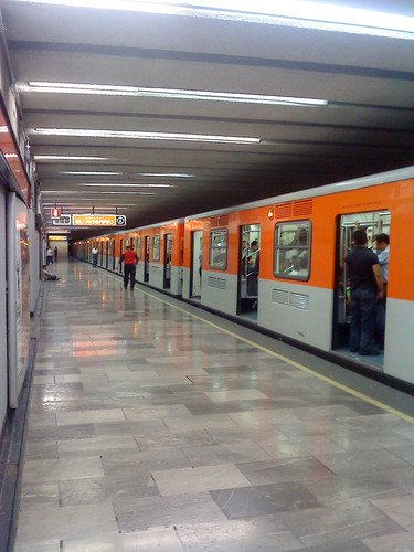 Tacuba station on Mexico City's Metro Line 7 with a blue and grey colored train