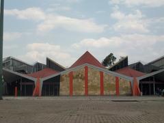 San Lázaro train station facade with pedestrian crossing and overhead power lines
