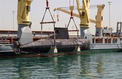 Royal Danish Navy submarine HDMS Saelen lifted aboard German vessel Grietje in Manama, Bahrain