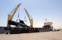 Royal Danish Navy submarine HDMS Saelen being lifted aboard German contract vessel Grietje in Manama, Bahrain