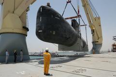 Royal Danish Navy submarine HDMS Saelen being lifted aboard German contract vessel Grietje in Manama, Bahrain