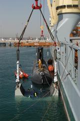 Royal Danish Navy submarine HDMS Saelen lifted aboard German vessel Grietje in Manama Bahrain 2003