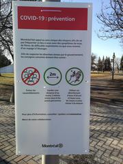 COVID-19 prevention poster in Montreal public places showing guidelines like avoiding gatherings, maintaining 2-meter distance, and hand hygiene