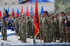 US and Albanian soldiers standing in formation at Mother Teresa Square during DEFENDER 23 exercise