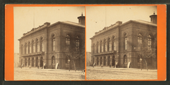 Historic Academy of Music building with ornate architectural details and spires