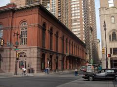 Facade of the American Academy of Music at the southwest corner of Broad and Locust Streets in Philadelphia with Academy House apartments in the background