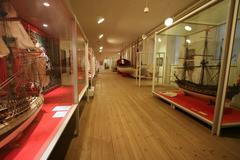 Interior view of Chalupsalen exhibition at The Royal Danish Naval Museum in Copenhagen showcasing naval vessels and maritime artifacts