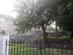 Archaeological ruins of Acanceh in Yucatán with ancient stone structures and greenery