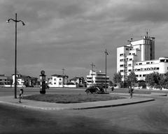 Old photo of Charles de Gaulle Square in Bucharest, Romania showing historic buildings and vintage cars
