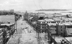 Historic view of Rue de la Commune near Youville Street in Montreal around 1910