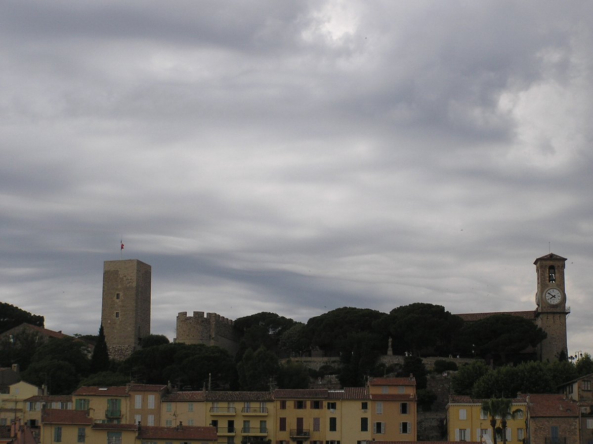 View of the Suquet Tower, Sainte-Anne Chapel, Notre-Dame-de-l'Espérance Church, and Place de la Castre in Cannes