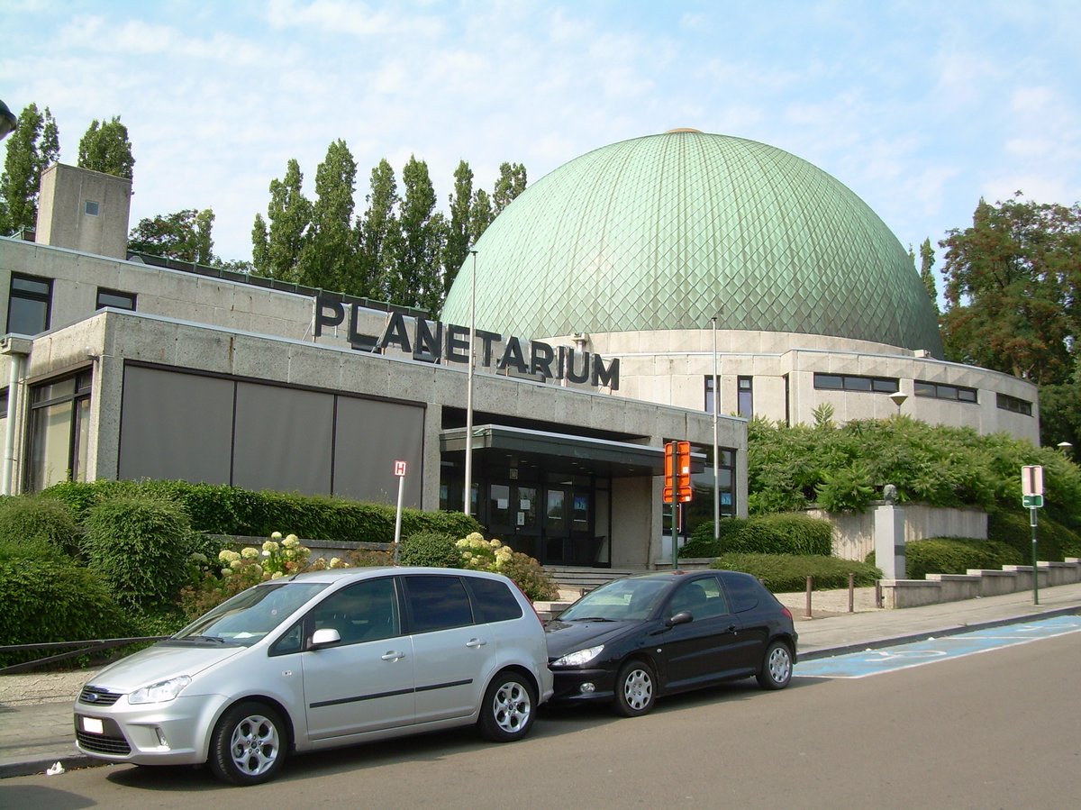 Planetarium of the Royal Observatory of Belgium at night with illuminated dome