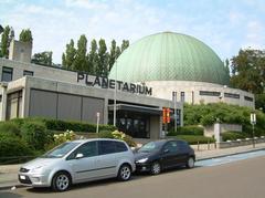 Planetarium of the Royal Observatory of Belgium at night with illuminated dome