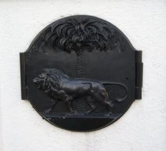 Crest of the Singapore Municipal Commission sculpted by Rodolfo Nolli on an iron cover for light switches at Elgin Bridge, Singapore