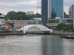 Elgin Bridge over the Singapore River with boats and historic buildings