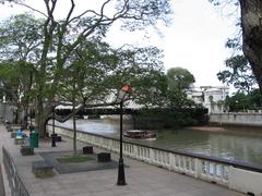 Scenic view of North Boat Quay Promenade with water reflections and city skyline