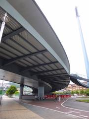 Euskalduna Bridge in Bilbao over the estuary at sunset with city buildings