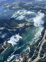 Bird eye view of Bridal Falls and Horseshoe Falls flowing with water