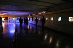 Mexico City Metro train arriving at station with passengers on platform