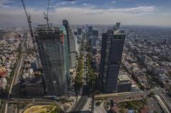 Aerial photograph of Mexico City skyline with prominent buildings and a clear sky