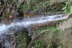 Himchari Fountain and Hill with lush greenery and blue sky