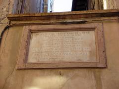 Epigrafe plaque dedicated to Francesco Guardabassi in Perugia on a wall