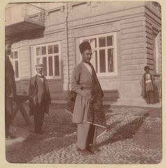 Azerbaijani man with carpet in Baku, 1900