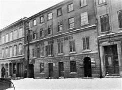 Vintage black and white photo of D. Hatton Co. Hotel Bon Secours on Rue de Bonsecours, Montreal, featuring Maison Papineau