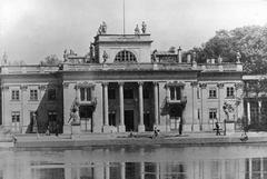 The famous Lazienki Palace before war damage in 1939 with children playing beside the lake
