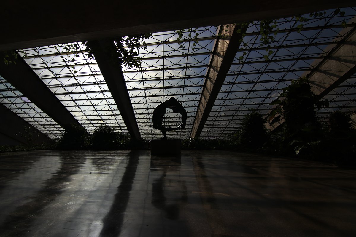 Interior view of the Cláudio Santoro National Theater in Brasília with bright stage lights and audience seating