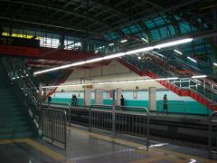 Oksu Station platform with seating and a train track