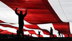 Airmen holding American flag at Sam Boyd Stadium before Las Vegas Bowl 2016