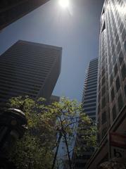 Looking up view of Embarcadero Station entrance with surrounding skyscrapers