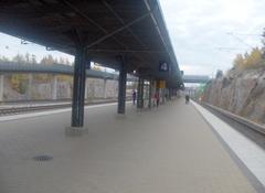 Railway station platform with tracks and overhead wires in Ilmala, Helsinki