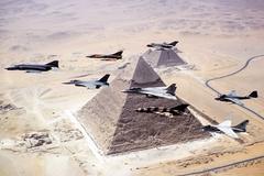 Formation of Egyptian and U.S. Navy warbirds flying over Great Pyramid near Cairo
