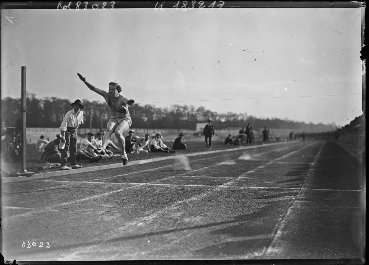Vintage photograph of Charley Paddock racing in a 60-meter sprint at Stade de la Porte Dorée, Saint-Mandé, France in 1923