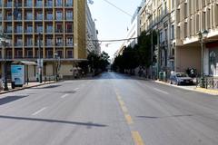 Stadiou Street in Athens near Klafthmonos Square with buildings and people